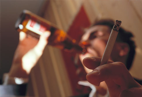 getty_rr_photo_of_man_drinking_beer_and_smoking.jpg